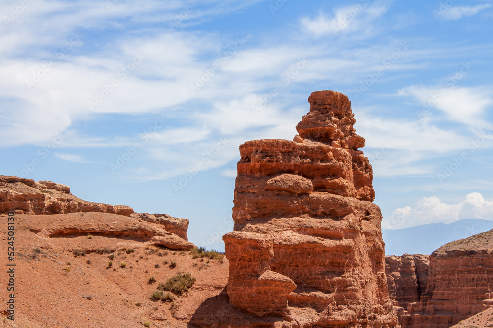Charyn Canyon is a canyon on the Sharyn River in Kazakhstan east of Almaty. Landscape on a clear sunny day in summer, there are many clouds in the sky.