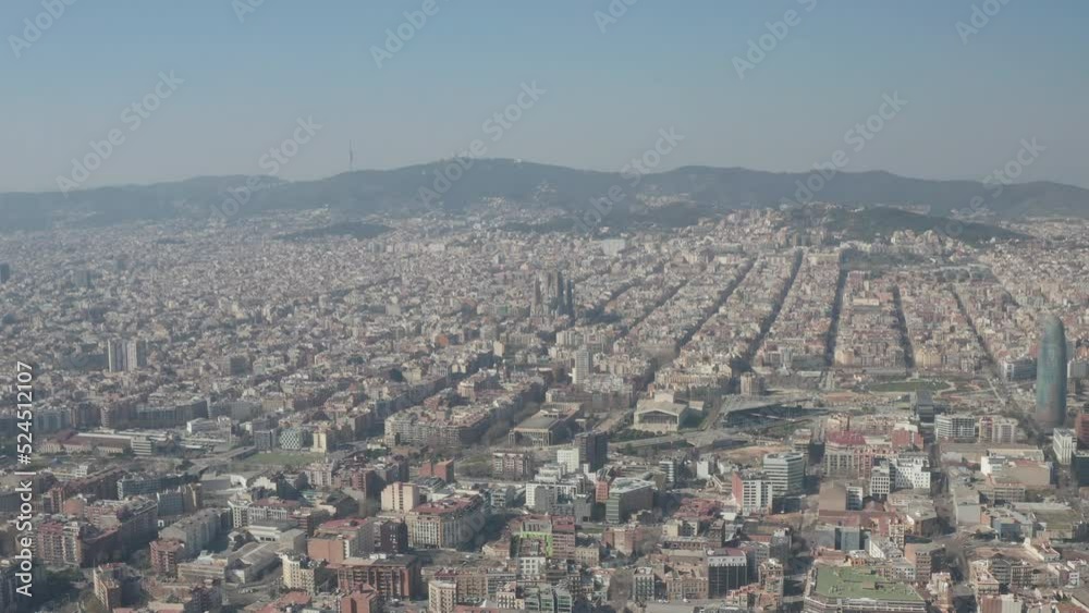 Forwards fly above metropolis. Blocks of various buildings in urban boroughs. Famous basilica Sagrada Familia in distance. Barcelona, Spain Forwards fly above metropolis. Blocks of various buildings in urban boroughs. Famous basilica Sagrada Familia in distance. Barcelona, Spain