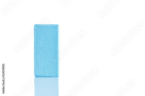 Wooden cube of blue color on a white background
