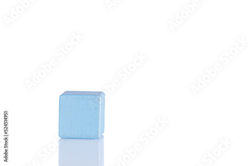 Wooden cube of blue color on a white background
