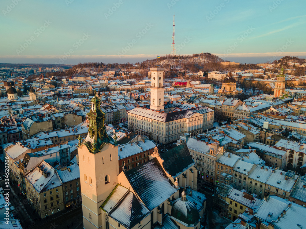 Naklejka premium aerial view of lviv city hall on sunset