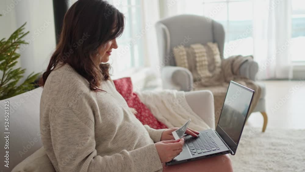 decorated christmas tree, a happy mold of a pregnant woman is watching a video of the ultrasound of the future baby on a laptop. expecting a baby, motherhood, happiness, pregnancy, christmas, miracle, decorated christmas tree, a happy mold of a pregnant woman is watching a video of the ultrasound of the future baby on a laptop. expecting a baby, motherhood, happiness, pregnancy, christmas, miracle,