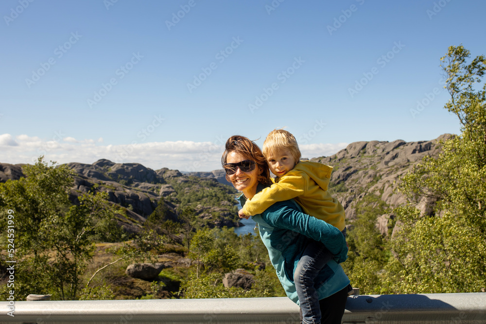 Happy people, enjoying amazing views in South Norway coastline, fjords, lakes, beautiful nature Happy people, enjoying amazing views in South Norway coastline, fjords, lakes, beautiful nature
