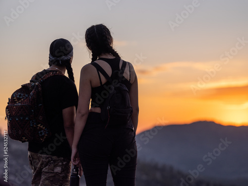 Horizontal image of Indigenous youth enjoying sunset