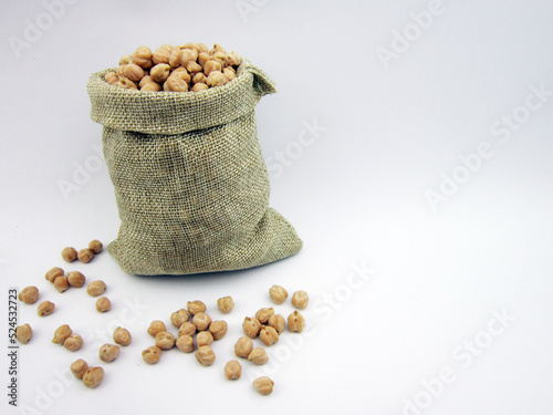   Close-up green chickpeas.Dried chickpeas in sack on the background            