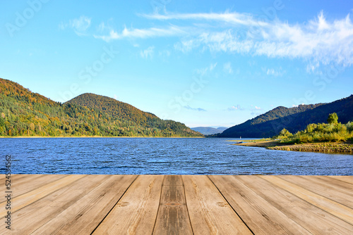 autumn landscape by the lake in the mountains with wooden pier on foreground © Jurek Adamski