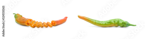 Sliced red hot chili pepper and whole green one isolated on white background side view. Seasoning for cooking. 