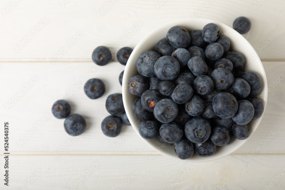 Blueberries in a bowl on white textured background. Ripe and fresh blueberries. Vitamins. Healthy food. Juicy berry.Copy space.Place for text Blueberries in a bowl on white textured background. Ripe and fresh blueberries. Vitamins. Healthy food. Juicy berry.Copy space.Place for text