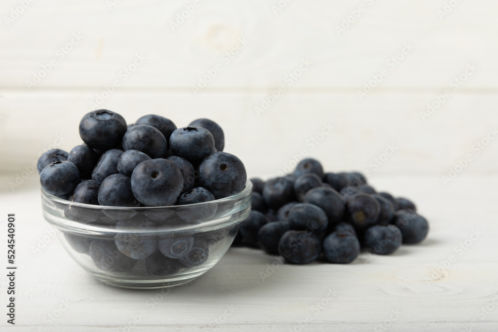 Blueberries in a bowl on white textured background. Ripe and fresh blueberries. Vitamins. Healthy food. Juicy berry.Copy space.Place for text Blueberries in a bowl on white textured background. Ripe and fresh blueberries. Vitamins. Healthy food. Juicy berry.Copy space.Place for text