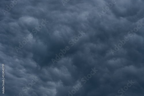 Storm rain clouds background. Dramatic dark sky.
