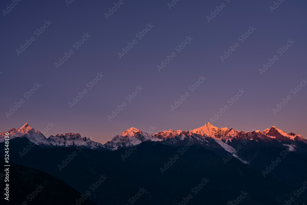 snow capped meili mountain range at sunrise, yunnan, china snow capped meili mountain range at sunrise, yunnan, china