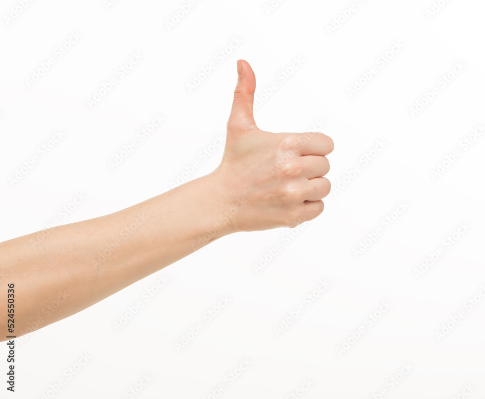 female hand shows gestures on a white background isolated.number direction fist approval female hand shows gestures on a white background isolated.number direction fist approval