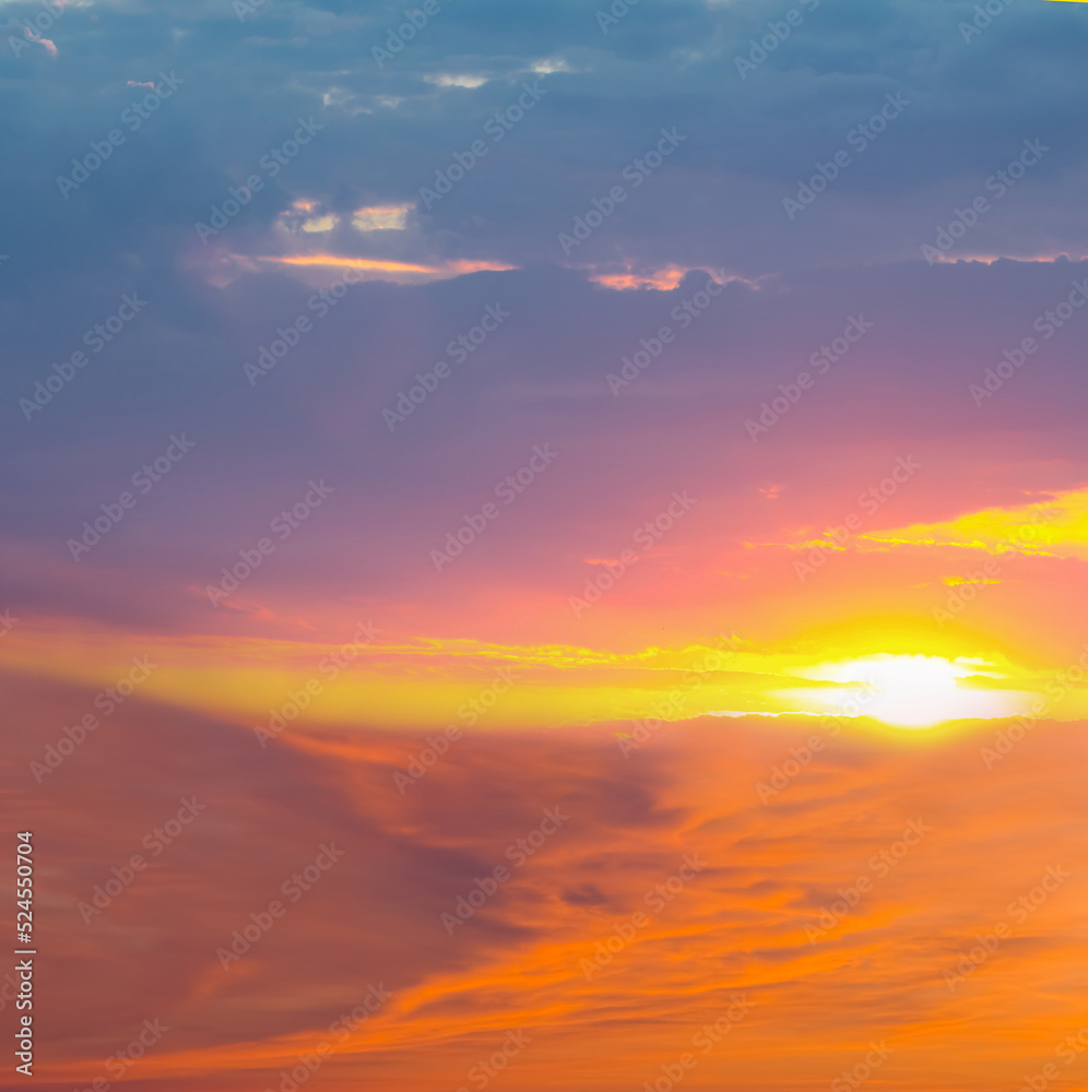 evening sun among dramatic dense clouds, dramatic natural sunset background