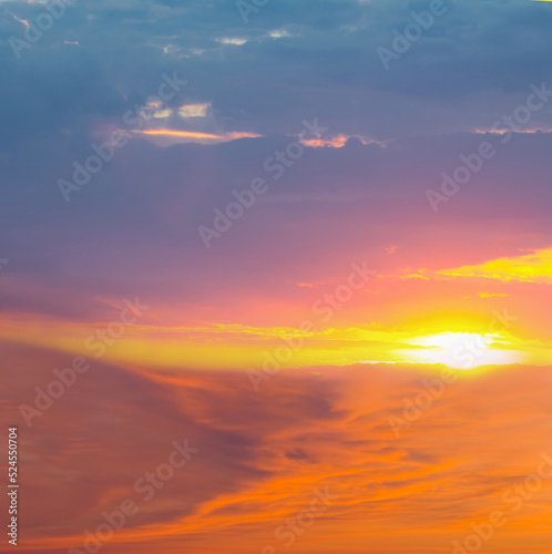 evening sun among dramatic dense clouds, dramatic natural sunset background