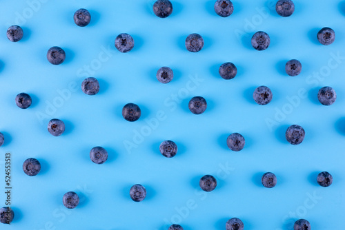 Blueberry isolated on blue background. Blueberries background. Healthy, natural fruit. Vegan and vegetarian concept. Summer healthy food.
