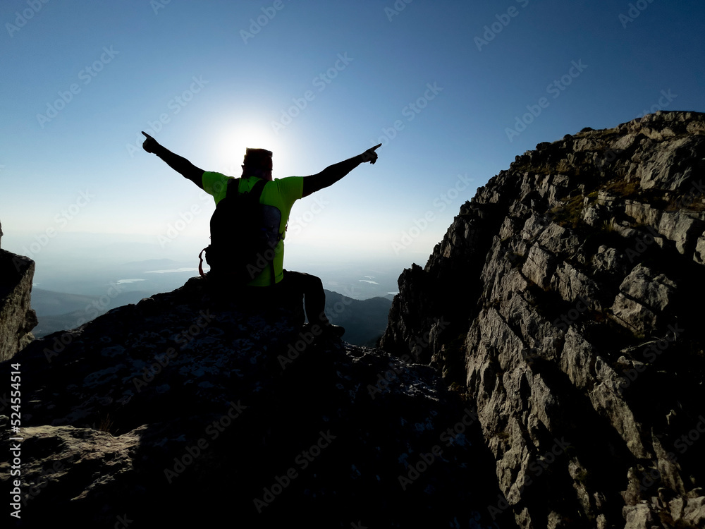the joy of victory and success of the mountaineer reaching the peaks of the high mountains