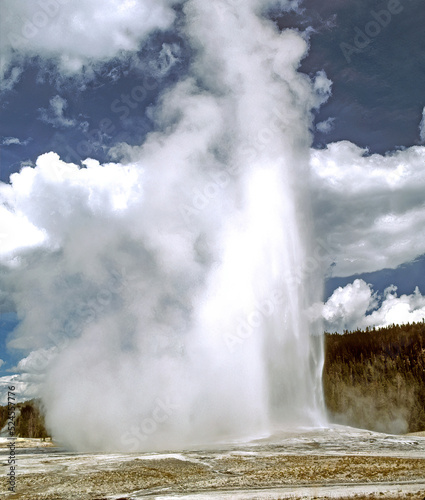 Old faithful geiser erupts every hour in Yellowstone National Park, Wyoming,