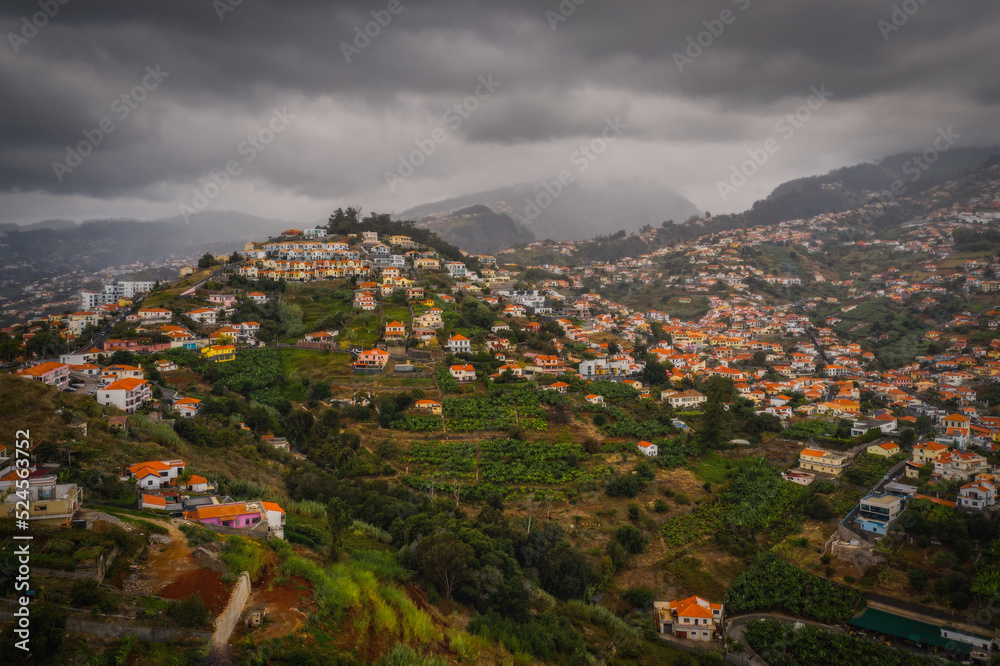Aerial panoramic view of Funchal city, Madeira, Portugal in foggy and rainy weather. October 2021
