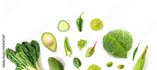 Foto Creative layout made of green vegetables on the white background