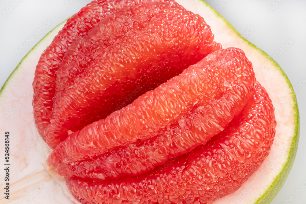 close up shot Red Pomelo isolated on white background, Fresh Red Pomelo citrus fruit on white background. close up shot Red Pomelo isolated on white background, Fresh Red Pomelo citrus fruit on white background.