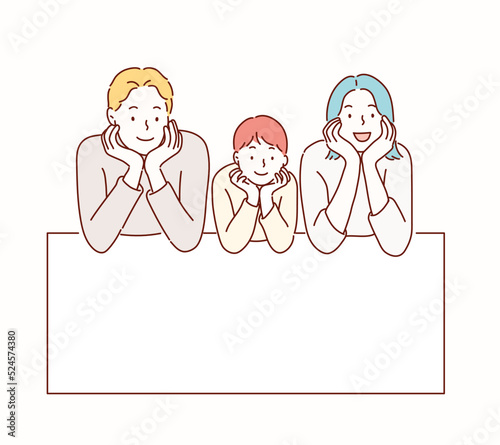 The family is lying on the floor looking forward.