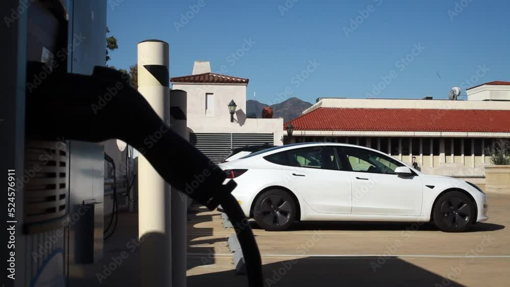Tesla Charges at EV Charge Station Tesla Charges at EV Charge Station