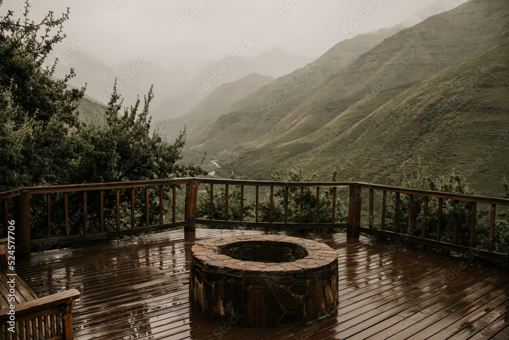 Fototapeta premium fire pit overlooking mountain valley in lesotho africa