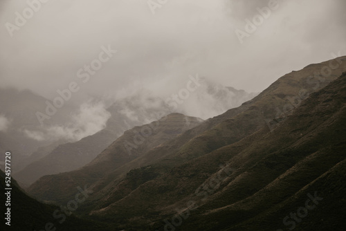 misty and cloudy mountains in lesotho africa photo