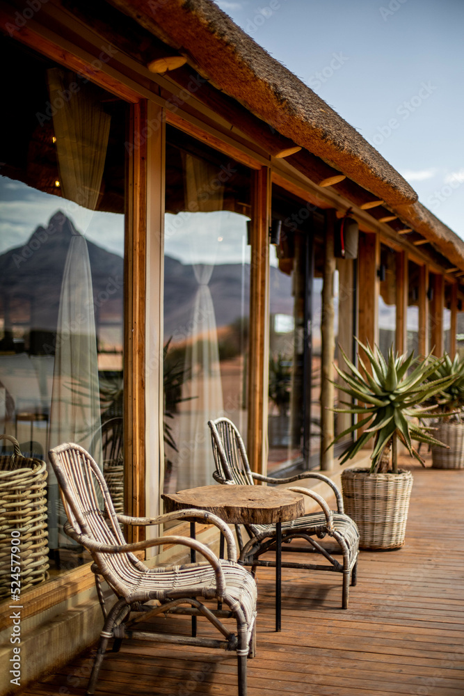 Fototapeta premium relaxing seats on the front porch of a resort in africa