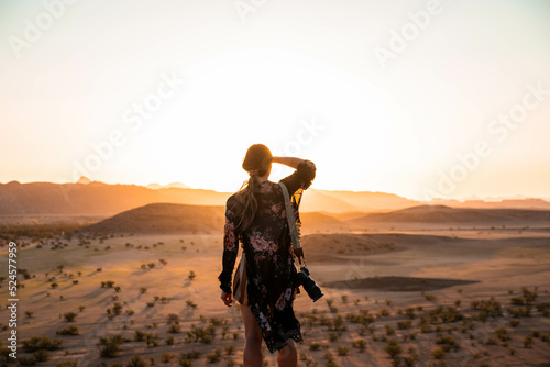silhouette of a person in a desert at sunset © Zach