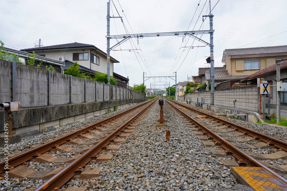 Local train roadway and grade crossing in Uji, Kyoto, Japan Local train roadway and grade crossing in Uji, Kyoto, Japan