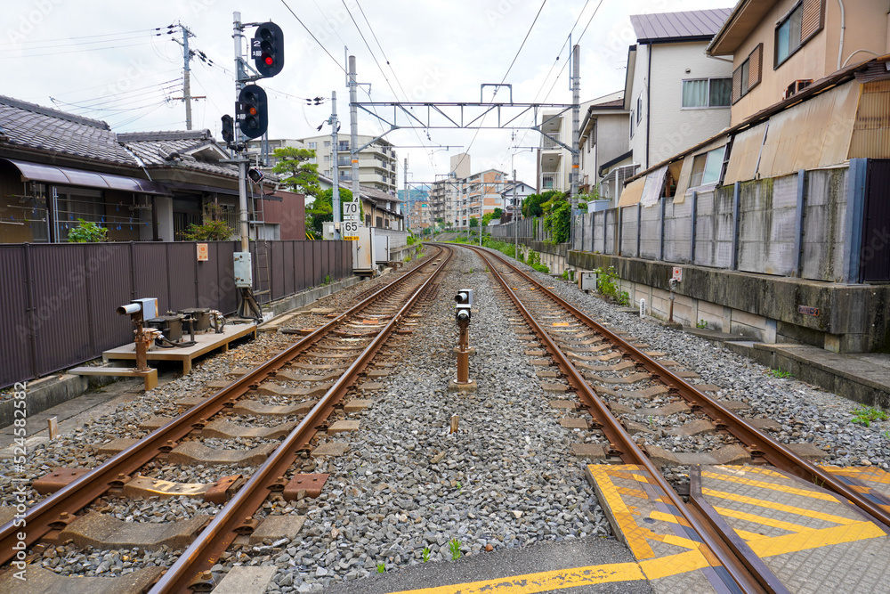 Local train roadway and grade crossing in Uji, Kyoto, Japan