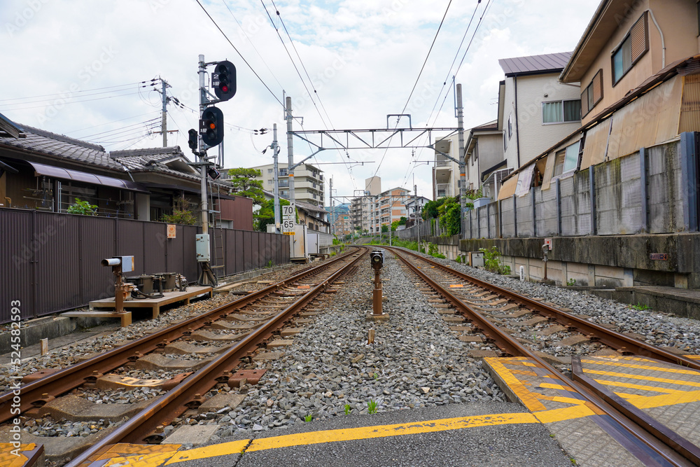 Local train roadway and grade crossing in Uji, Kyoto, Japan