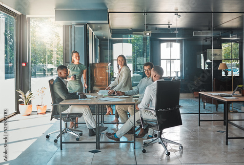 Corporate business meeting, team collaboration and strategy planning in a startup company. Office workers, diversity employees and workforce having discussion, brainstorm and speaking in an agency photo