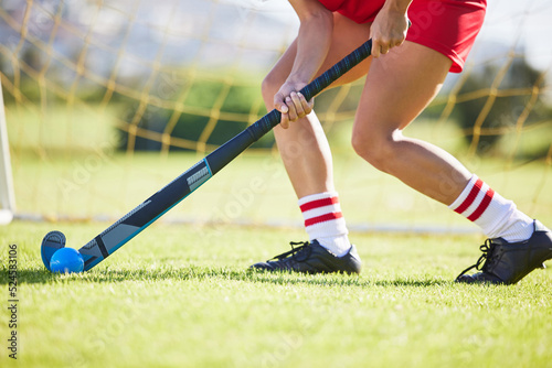 Photography Field hockey, sports and training with a player hitting a ball with a stick and practicing for a match or sport event