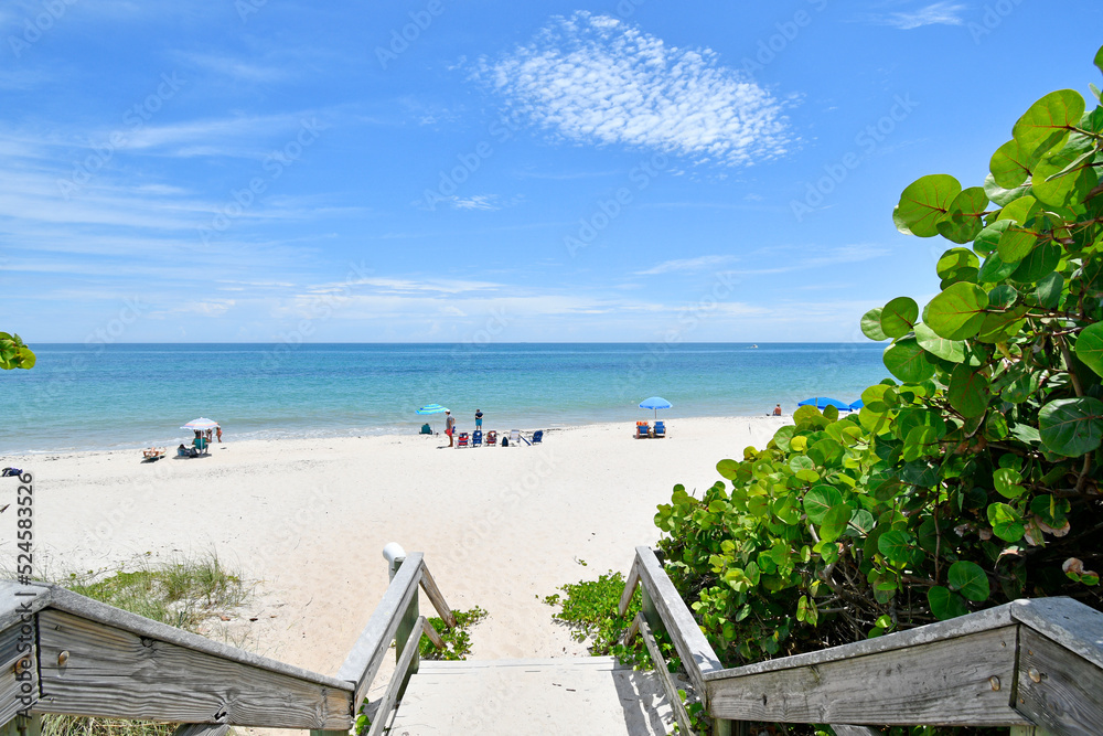Boardwalk leading to a view of calm, sandy, and uncrowded Vero Beach, Florida on Hutchinson Island