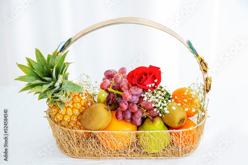 Fototapeta Naklejka Na Ścianę i Meble -  large group of organic fresh fruits in a basket on white background.