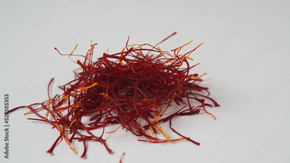 Naklejka premium Expensive Red Dried saffron spice on white background