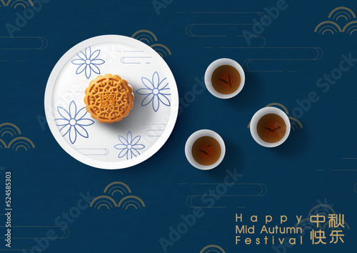 Chinese moon cakes on white plate with tea cups and wording of even on Chinese elements pattern and dark blue background. Chinese texts is meaning Happy mid autumn festival in English.