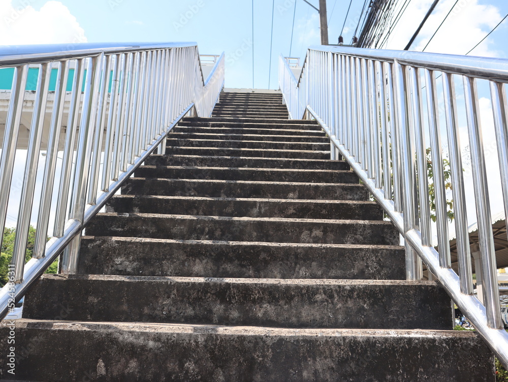 Bottom view of stairs of the pedestrian overpass in the city Bottom view of stairs of the pedestrian overpass in the city