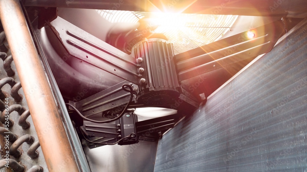 The condenser fan is seen from the inside which functions to release heat from the heat of the