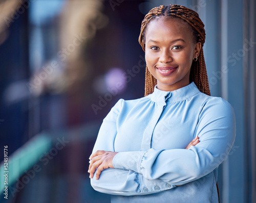 Photographie Confident, proud and satisfied business woman standing with arms crossed at office, ceo showing smile and leader working corporate on balcony at work