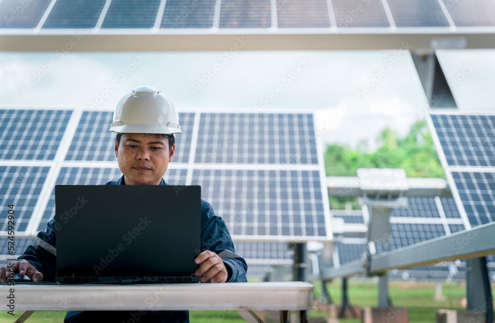 The solar farm(solar panel) with engineers check the operation of the system, Alternative energy to conserve the world's energy, Photovoltaic module idea for clean energy production The solar farm(solar panel) with engineers check the operation of the system, Alternative energy to conserve the world's energy, Photovoltaic module idea for clean energy production