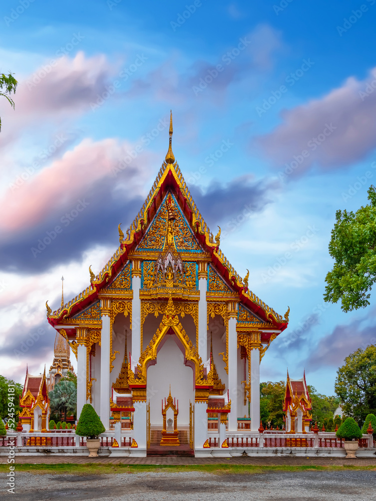 Naklejka premium Beautiful Wat Chalong Buddhist temples in Phuket Thailand. Decorated in beautiful ornate colours of red and Gold and Blue. Lovely Sky