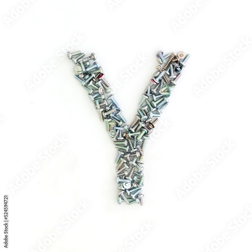 Capital letter Y made from screws and bolts. Alphabet made from used screws. White background. Industrial bolt font