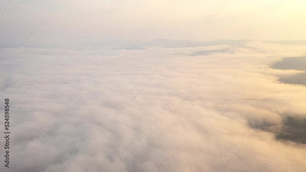 Epic Flight Over Clouds in Mountains. Inspiring Aerial Landscape. Sunrise Sunset golden hour Epic Flight Over Clouds in Mountains. Inspiring Aerial Landscape. Sunrise Sunset golden hour