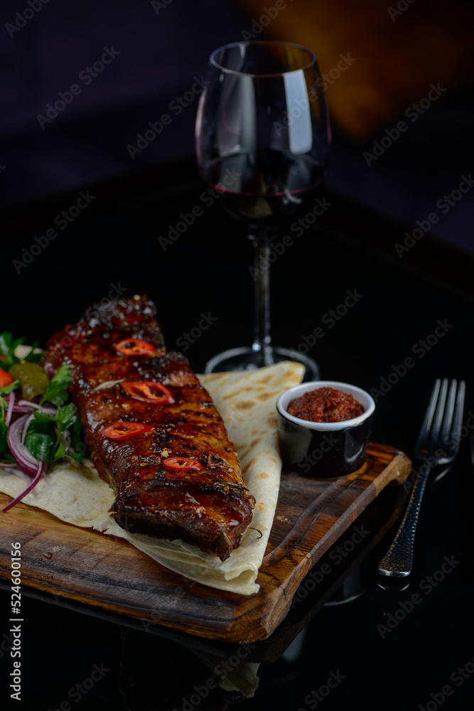 fried ribs on pita bread with salad
fried ribs on pita bread with salad