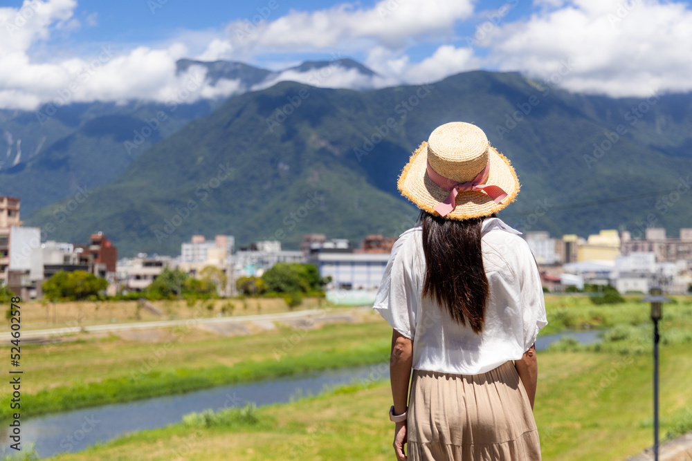 Woman look at the scenery landscape view in Taiwan