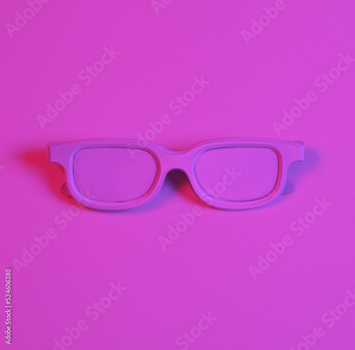 White glasses in pink-blue neon light. Minimalism music concept