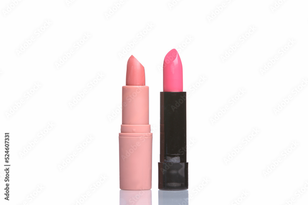 Obraz premium Two Pink lipstick tubes isolated on white background